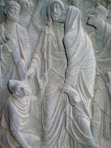 Judas betraying Jesus, German bas relief.jpg